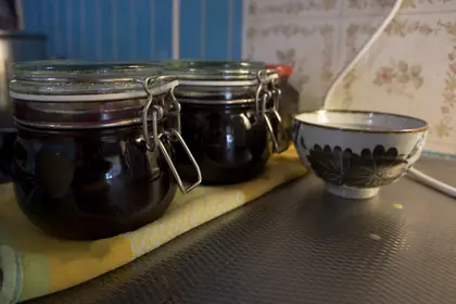 Black currant jam in a glass jar