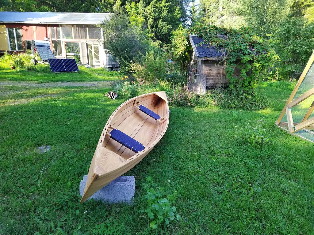 A Vendia canoe in the yard at Beyond Buckthorns